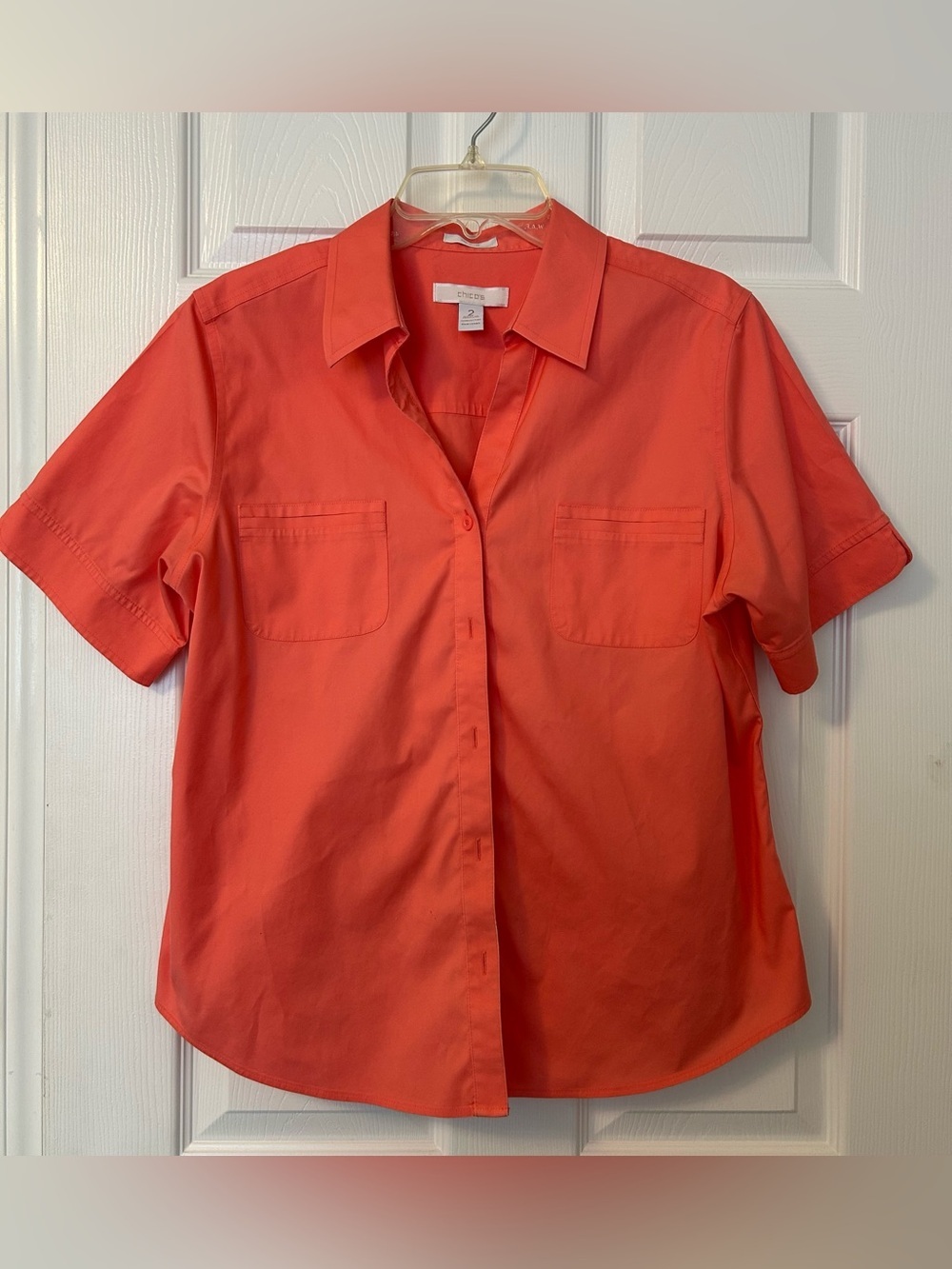 Chico's women's coral button-front design and chest pockets. Coral/ size 2